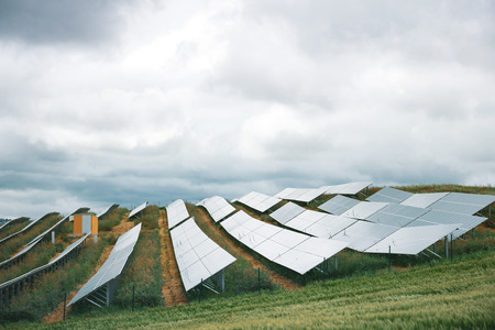 Alternative electricity source, wheat field with solar panelsの写真素材