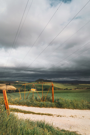 Beautiful rural landscape on spring, gate of farm の写真素材