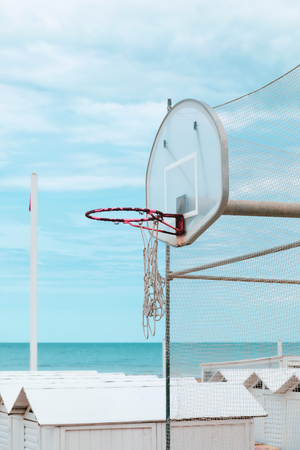 Beach playground, old basketball board, sea view