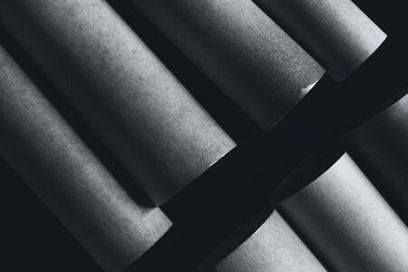 Composition with cylindrical elements, dark abstract backgroundの写真素材