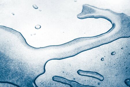 Water drops on rough silvery background, close-upの写真素材