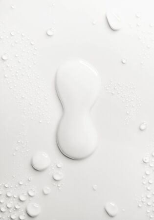 Water drops on smooth white background, close-upの写真素材