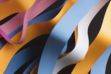 Colorful curved ribbons on black background, abstractの写真素材
