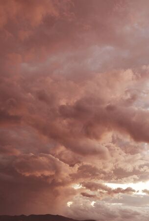 Dramatic sky with cumulus clouds at dusk, natural background