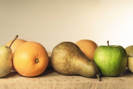 Close-up of autumn fruit on wooden table, still lifeの写真素材
