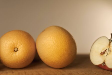 Close-up of autumn fruit on wooden table, still lifeの写真素材