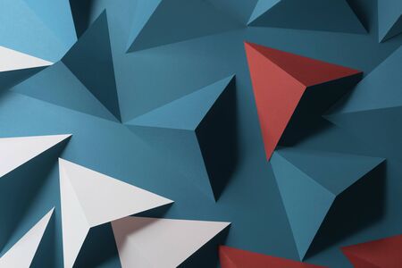Triangular shapes of paper on blue background, abstract 3d illustrationの写真素材