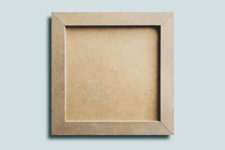 Close-up of back wooden picture , isolated on light blue backgroundの写真素材