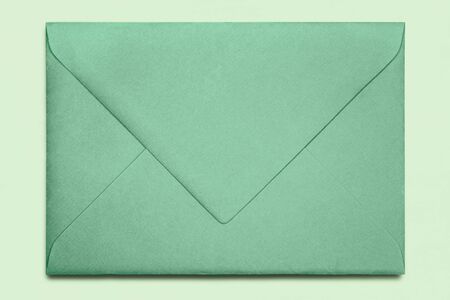 Close-up of green envelope , isolated on backgroundの写真素材