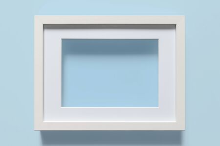 Close-up of white frame on light blue backgroundの写真素材