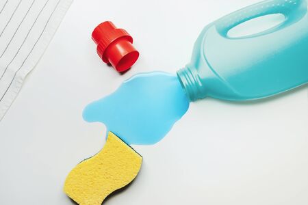 Liquid detergent and yellow sponge, isolated on whiteの写真素材