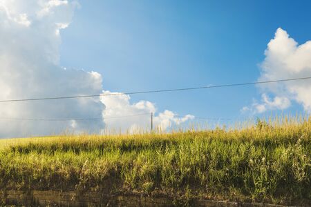 Beautiful landscape of countryside on spring, fields and skyの写真素材