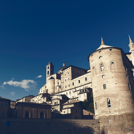 Urbino, Italy - June 17, 2020: Ducal Palace facade. View from Mercatale at sunsetのeditorial素材
