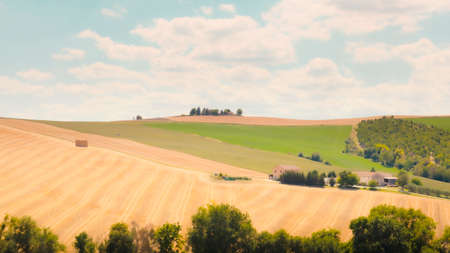 Scenic view of countryside landscape with cultivated fieldsの写真素材