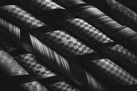 Rolled up paper on black background, abstractの写真素材