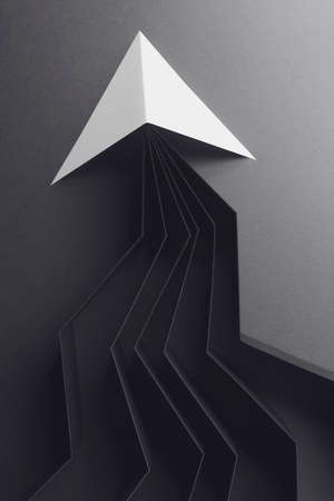 Creative image, white arrow on black paper backgroundの写真素材