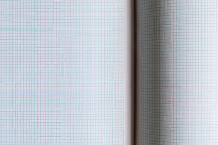 Close-up of open notebook, squared sheets