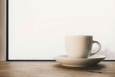 Autumn days at home, cup of coffee on the windowsillの写真素材