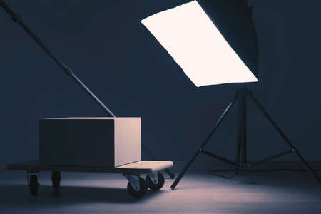 Interior of photographic studio, tripod, lamp and objectsの写真素材