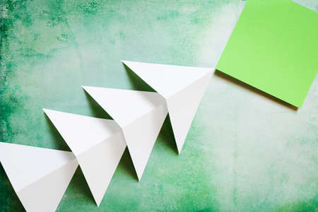 Notes paper with arrows on grunge background greenの写真素材