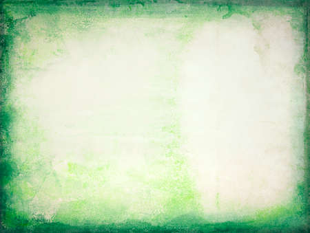 Yellow paper sheet with green edges, texture backgroundの写真素材