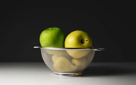 Fruit basket close-up, dark backgroundの写真素材