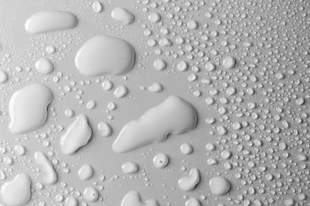 Close-up of water drops on smooth surface, backgroundの写真素材
