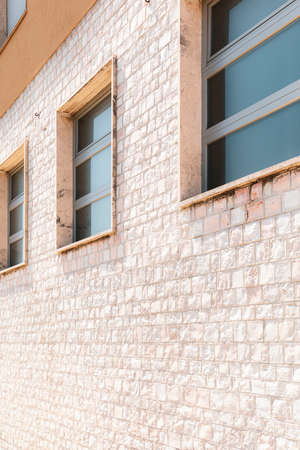 Building exterior, perspective view of facade with windowsの写真素材