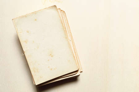 Old manuscript isolated on wooden backgroundの写真素材