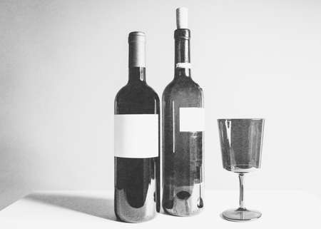 Wine bottles and glass, isolated on whiteの写真素材