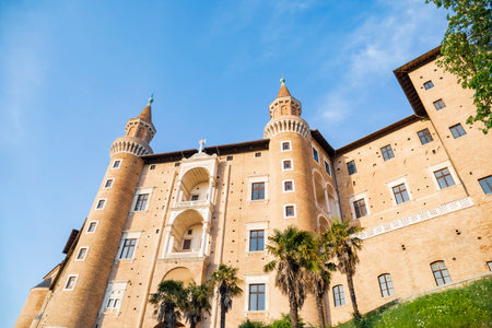 Palazzo Ducale Urbino, Italy - April 30, 2022: Perspective view of the facade torricini at sunsetのeditorial素材