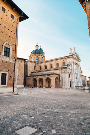 Palazzo Ducale Urbino, Italy - April 30, 2022: Cathedral of Santa Maria Assunta view from the Piazza Duca Federico.のeditorial素材
