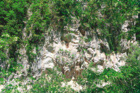 View of mountain rock face, sunny dayの写真素材