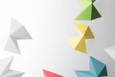 Close-up of geometric shapes made paper, isolated on gray