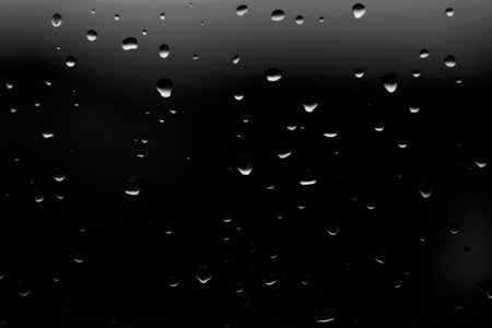 drops of rain on the window, black and white tone, abstract backgroundの写真素材