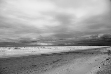 Beach view with rough sea, black and whiteの写真素材