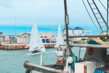 Sailing boats in the canal of port, nautical sportの写真素材