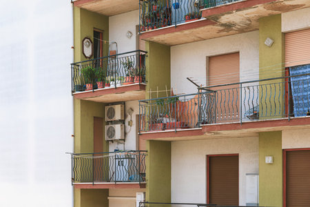 Popular housing, facade of building with balcony and window, copy space white wallの写真素材