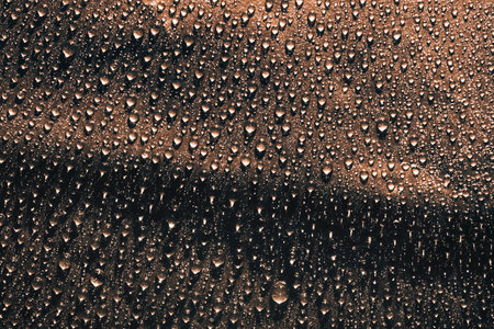 Water drops on brown surface, texture backgroundの写真素材