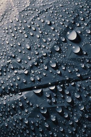 Water drops on blue surface, texture backgroundの写真素材
