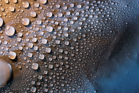 Water drops on blue surface, texture backgroundの写真素材
