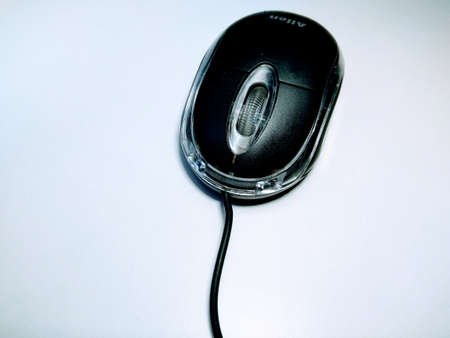 Black wired computer mouse on white backgroundの写真素材