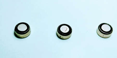 Macro round batteries on white background