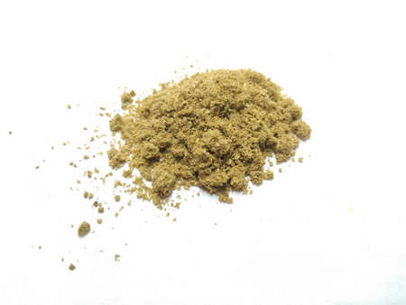 A picture of coriander powder on a white backgroundの写真素材
