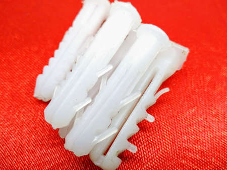 A picture of plastic screws on white background