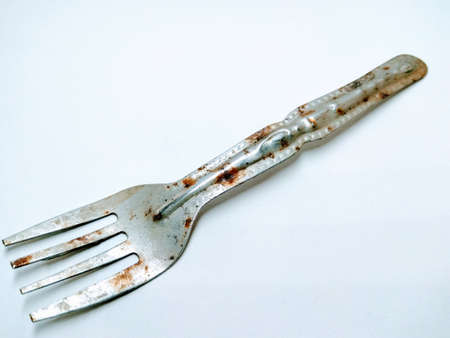 A picture of rusted fork isolated on a white backgroundの写真素材
