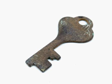 A picture of rusted key isolated on white backgroundの写真素材