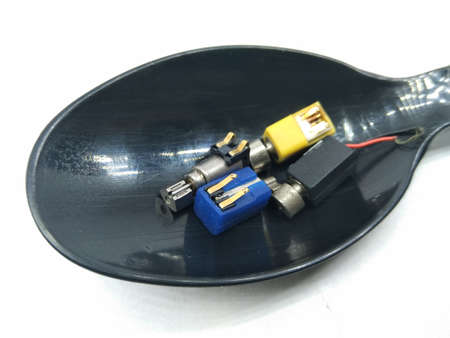 A picture of vibration motor on black spoon