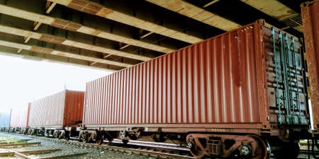 Containers loaded on train wagons on a railwayの写真素材