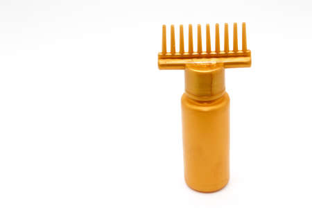 A picture of hair oil bottle on white background
